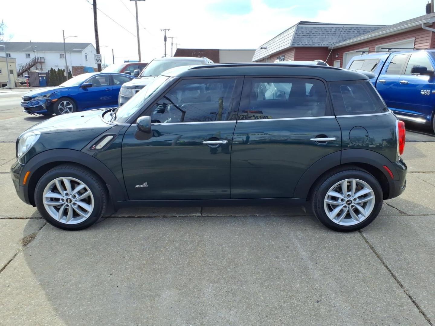 2013 Oxford Green Metallic MINI Countryman Cooper S ALL4 (WMWZC5C59DW) with an 1.6L 1.6L Turbo I4 181hp 177ft. lbs. Direct Injection engine, 6-Speed Shiftable Automatic transmission, located at 5505 N. Summit St., Toledo, OH, 43611, (419) 729-2688, 41.654953, -83.530014 - Photo#21