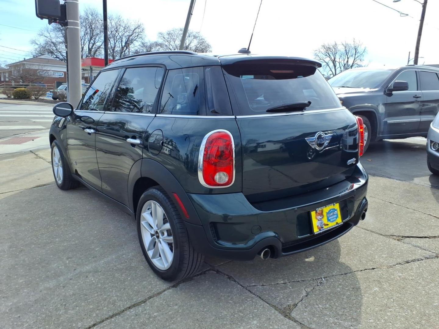 2013 Oxford Green Metallic MINI Countryman Cooper S ALL4 (WMWZC5C59DW) with an 1.6L 1.6L Turbo I4 181hp 177ft. lbs. Direct Injection engine, 6-Speed Shiftable Automatic transmission, located at 5505 N. Summit St., Toledo, OH, 43611, (419) 729-2688, 41.654953, -83.530014 - Photo#22
