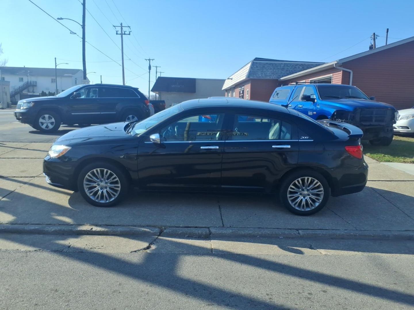 2013 Black Clear Coat Chrysler 200 Limited (1C3CCBCG6DN) with an 3.6L Pentastar 3.6L Flex Fuel V6 283hp 260ft. lbs. Sequential Multiport Fuel Injection engine, 6-Speed Shiftable Automatic transmission, located at 5505 N. Summit St., Toledo, OH, 43611, (419) 729-2688, 41.654953, -83.530014 - Photo#16