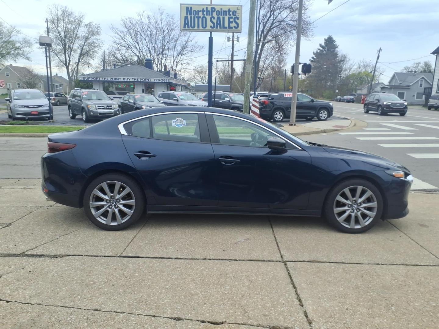 2021 Deep Crystal Blue Mica 42m Mazda Mazda3 Sedan Preferred (JM1BPBCL5M1) with an 2.5L SKYACTIV-G 2.5L I4 186hp 186ft. lbs. Direct Injection engine, 6-Speed Shiftable Automatic w/Sport Transmission transmission, located at 5505 N. Summit St., Toledo, OH, 43611, (419) 729-2688, 41.654953, -83.530014 - Photo#0