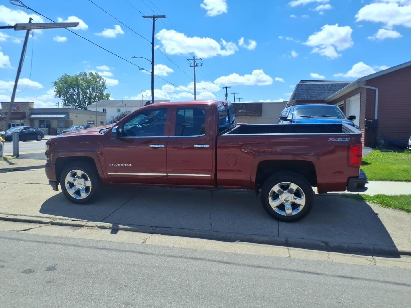 2016 Siren Red Tintcoat G1e Chevrolet Silverado 1500 LTZ (1GCVKSEC3GZ) with an 5.3L EcoTec3 5.3L V8 355hp 383ft. lbs. Direct Injection engine, 8-Speed Shiftable Automatic transmission, located at 5505 N. Summit St., Toledo, OH, 43611, (419) 729-2688, 41.654953, -83.530014 - Photo#17