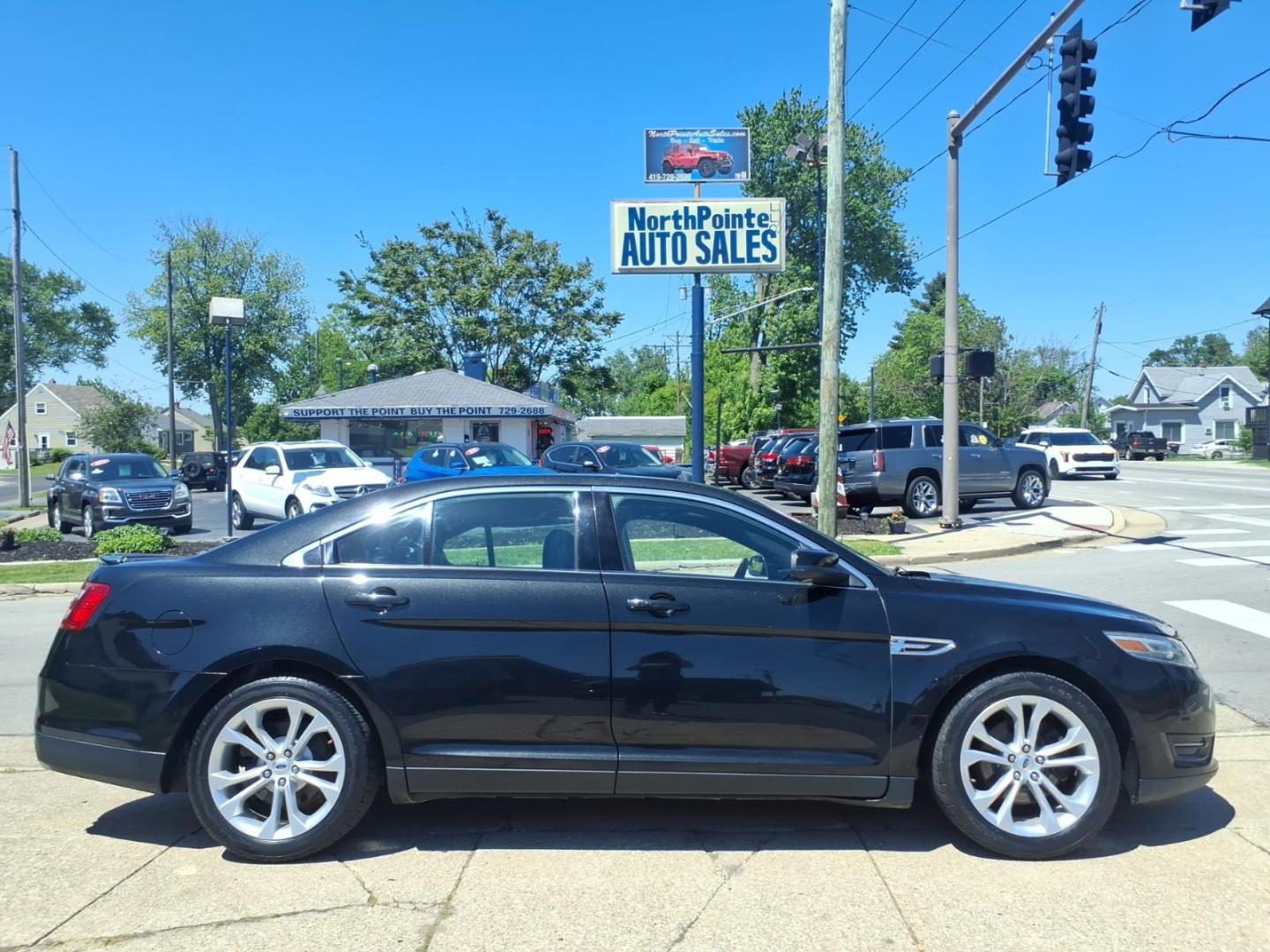 2013 Black Ford Taurus SEL (1FAHP2H84DG) with an 3.5L V6 288hp 254ft. lbs. Sequential Multiport Fuel Injection engine, 6-Speed Shiftable Automatic transmission, located at 5505 N. Summit St., Toledo, OH, 43611, (419) 729-2688, 41.654953, -83.530014 - Photo#0