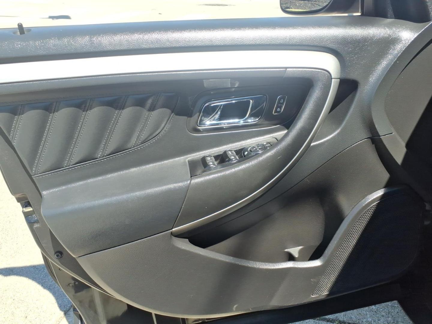 2013 Black Ford Taurus SEL (1FAHP2H84DG) with an 3.5L V6 288hp 254ft. lbs. Sequential Multiport Fuel Injection engine, 6-Speed Shiftable Automatic transmission, located at 5505 N. Summit St., Toledo, OH, 43611, (419) 729-2688, 41.654953, -83.530014 - Photo#1