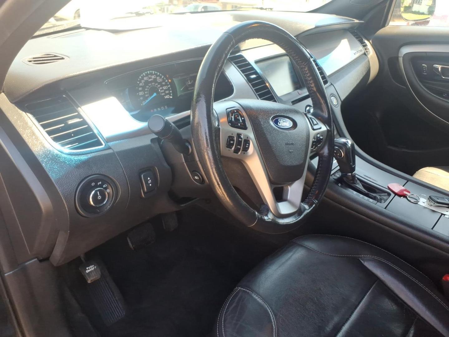 2013 Black Ford Taurus SEL (1FAHP2H84DG) with an 3.5L V6 288hp 254ft. lbs. Sequential Multiport Fuel Injection engine, 6-Speed Shiftable Automatic transmission, located at 5505 N. Summit St., Toledo, OH, 43611, (419) 729-2688, 41.654953, -83.530014 - Photo#5