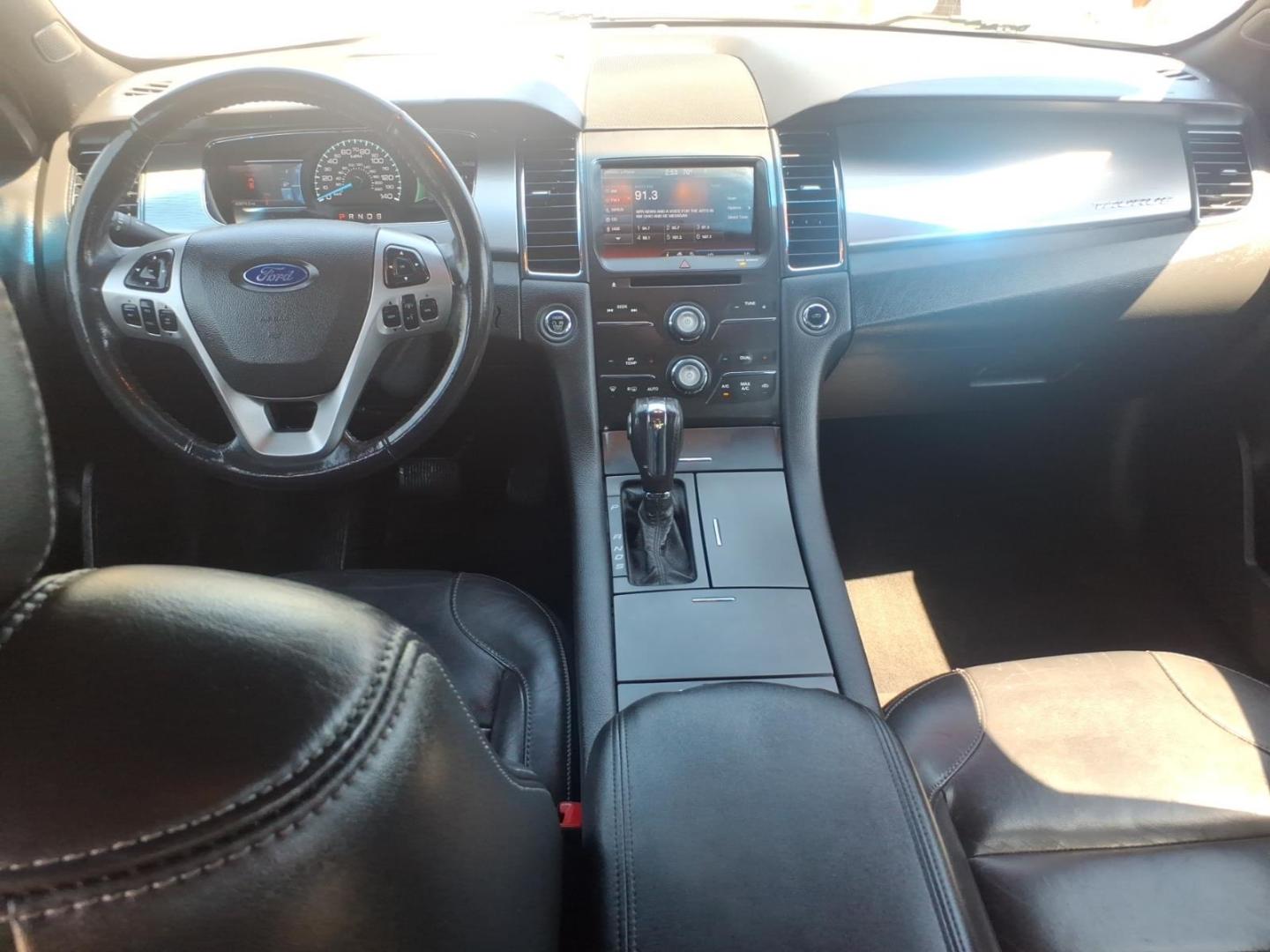 2013 Black Ford Taurus SEL (1FAHP2H84DG) with an 3.5L V6 288hp 254ft. lbs. Sequential Multiport Fuel Injection engine, 6-Speed Shiftable Automatic transmission, located at 5505 N. Summit St., Toledo, OH, 43611, (419) 729-2688, 41.654953, -83.530014 - Photo#16