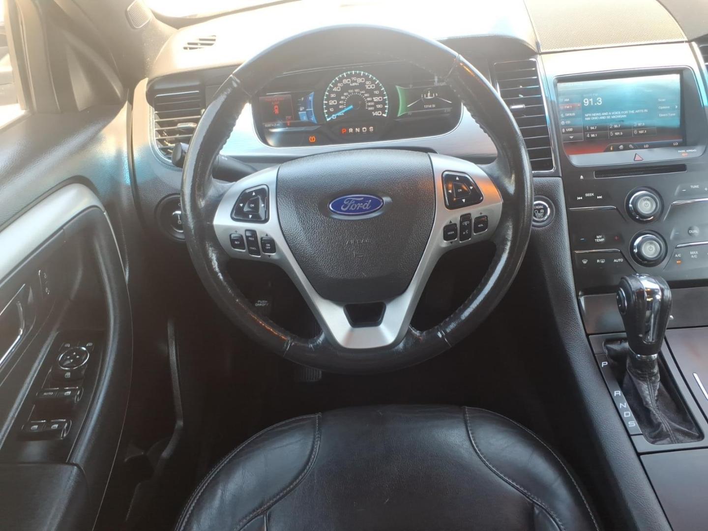 2013 Black Ford Taurus SEL (1FAHP2H84DG) with an 3.5L V6 288hp 254ft. lbs. Sequential Multiport Fuel Injection engine, 6-Speed Shiftable Automatic transmission, located at 5505 N. Summit St., Toledo, OH, 43611, (419) 729-2688, 41.654953, -83.530014 - Photo#17