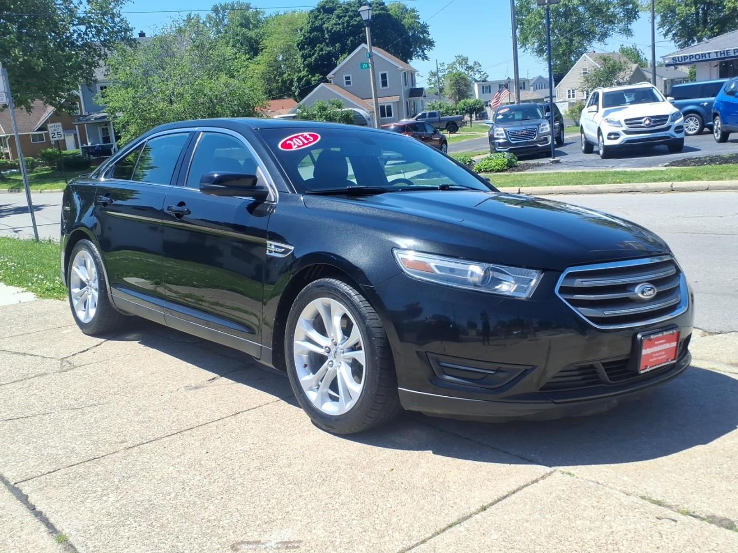 2013 Black Ford Taurus SEL (1FAHP2H84DG) with an 3.5L V6 288hp 254ft. lbs. Sequential Multiport Fuel Injection engine, 6-Speed Shiftable Automatic transmission, located at 5505 N. Summit St., Toledo, OH, 43611, (419) 729-2688, 41.654953, -83.530014 - Photo#20