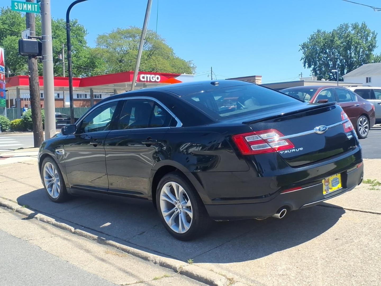 2013 Black Ford Taurus SEL (1FAHP2H84DG) with an 3.5L V6 288hp 254ft. lbs. Sequential Multiport Fuel Injection engine, 6-Speed Shiftable Automatic transmission, located at 5505 N. Summit St., Toledo, OH, 43611, (419) 729-2688, 41.654953, -83.530014 - Photo#24