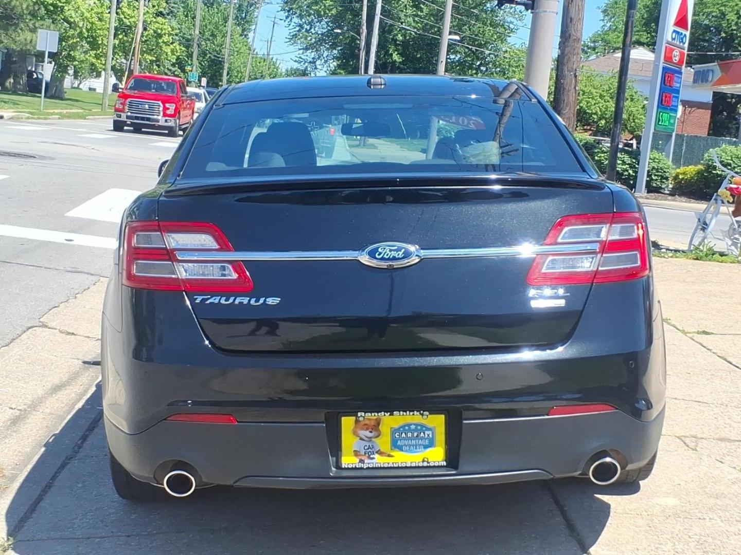 2013 Black Ford Taurus SEL (1FAHP2H84DG) with an 3.5L V6 288hp 254ft. lbs. Sequential Multiport Fuel Injection engine, 6-Speed Shiftable Automatic transmission, located at 5505 N. Summit St., Toledo, OH, 43611, (419) 729-2688, 41.654953, -83.530014 - Photo#25