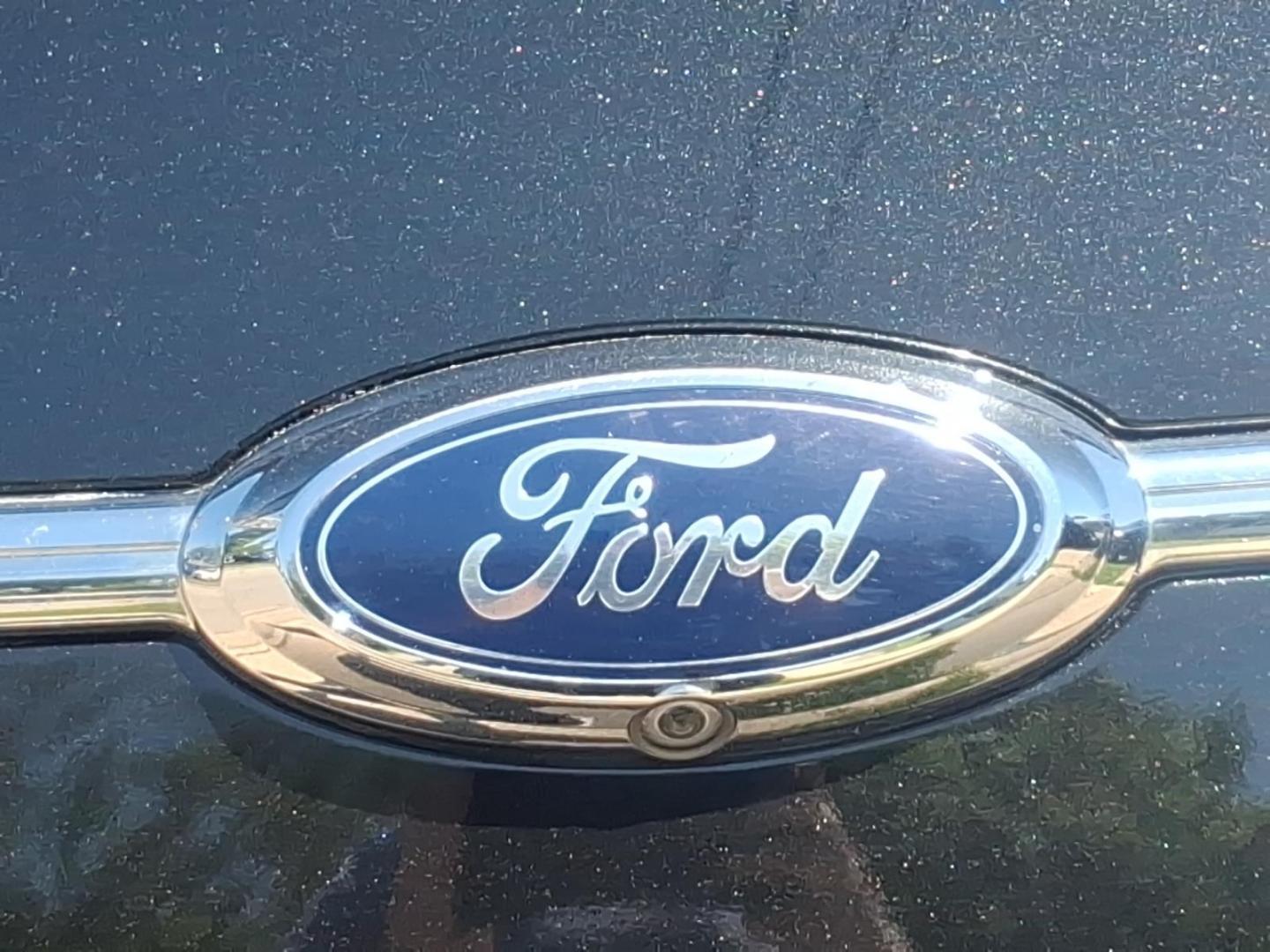 2013 Black Ford Taurus SEL (1FAHP2H84DG) with an 3.5L V6 288hp 254ft. lbs. Sequential Multiport Fuel Injection engine, 6-Speed Shiftable Automatic transmission, located at 5505 N. Summit St., Toledo, OH, 43611, (419) 729-2688, 41.654953, -83.530014 - Photo#26