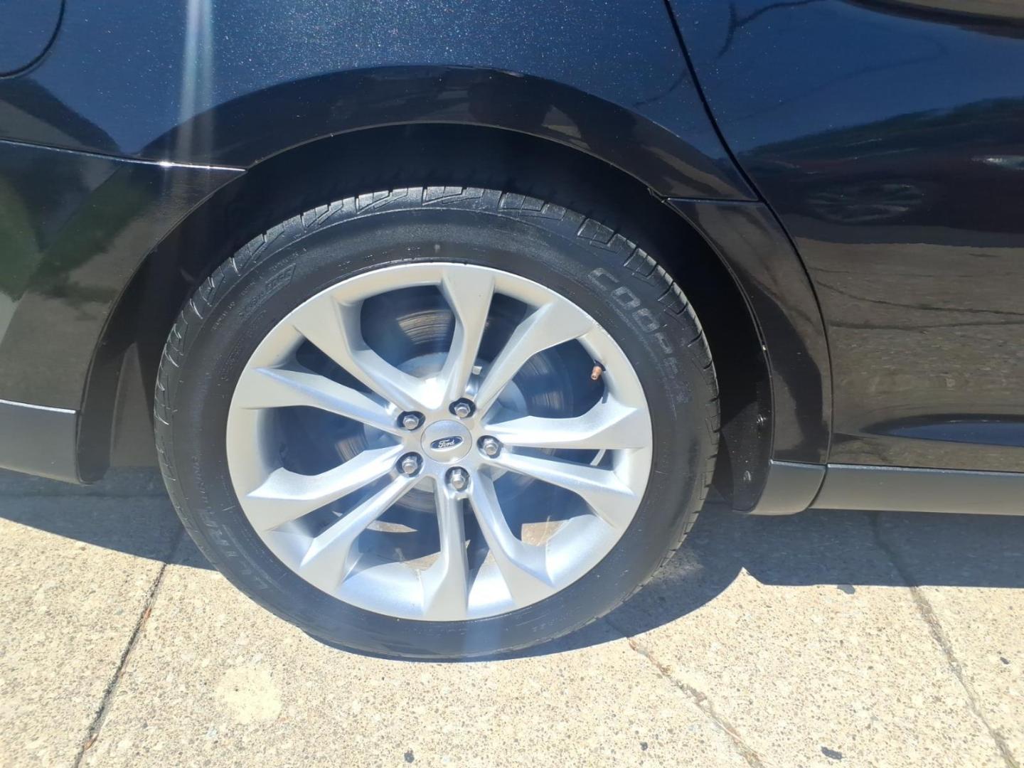 2013 Black Ford Taurus SEL (1FAHP2H84DG) with an 3.5L V6 288hp 254ft. lbs. Sequential Multiport Fuel Injection engine, 6-Speed Shiftable Automatic transmission, located at 5505 N. Summit St., Toledo, OH, 43611, (419) 729-2688, 41.654953, -83.530014 - Photo#29