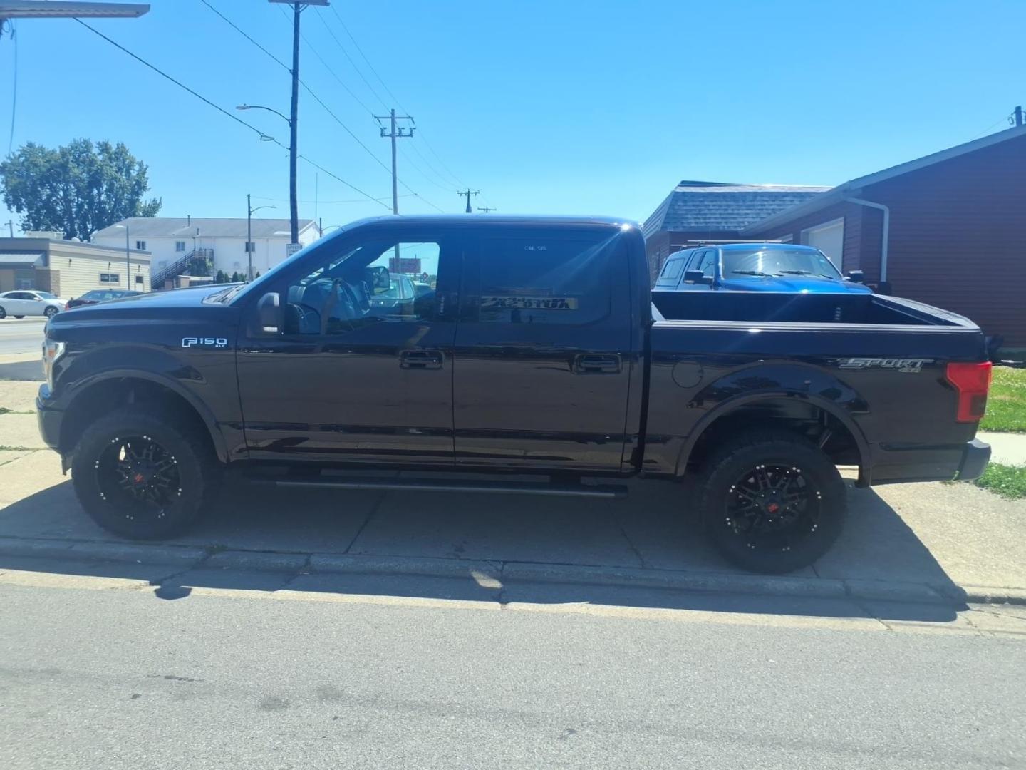 2018 Ruby Red Metallic Tinted Clearcoat Ford F-150 XLT (1FTEW1E53JF) with an 5.0L V8 395hp 400ft. lbs. Direct Injection engine, 10-Speed Shiftable Automatic transmission, located at 5505 N. Summit St., Toledo, OH, 43611, (419) 729-2688, 41.654953, -83.530014 - Photo#15