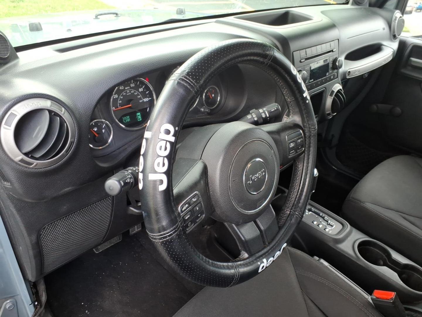 2014 Gray Jeep Wrangler Unlimited Sport (1C4BJWDG7EL) with an 3.6L 3.6L V6 285hp 260ft. lbs. Sequential Multiport Fuel Injection engine, Automatic transmission, located at 5505 N. Summit St., Toledo, OH, 43611, (419) 729-2688, 41.654953, -83.530014 - Photo#2
