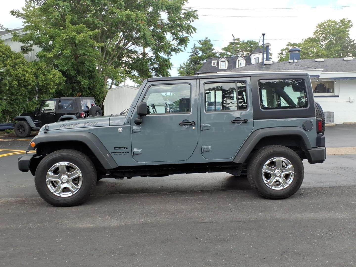 2014 Gray Jeep Wrangler Unlimited Sport (1C4BJWDG7EL) with an 3.6L 3.6L V6 285hp 260ft. lbs. Sequential Multiport Fuel Injection engine, Automatic transmission, located at 5505 N. Summit St., Toledo, OH, 43611, (419) 729-2688, 41.654953, -83.530014 - Photo#12