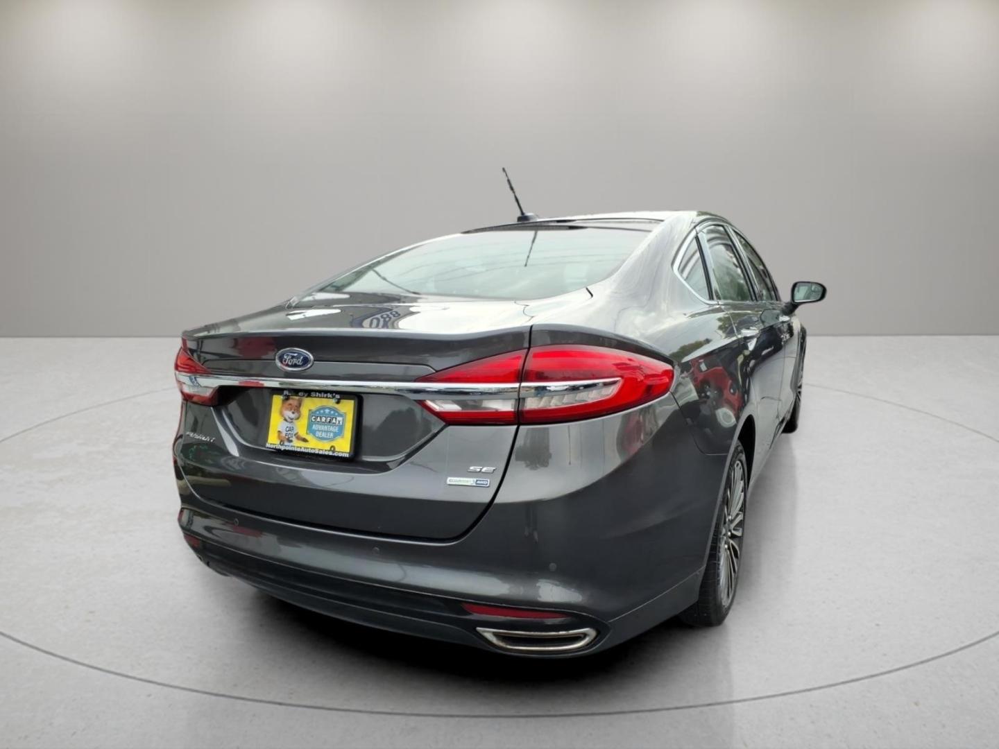 2018 Magnetic J7 Ford Fusion SE (3FA6P0T91JR) with an 2.0L EcoBoost 2.0L Turbo I4 245hp 275ft. lbs. Direct Injection engine, 6-Speed Shiftable Automatic transmission, located at 5505 N. Summit St., Toledo, OH, 43611, (419) 729-2688, 41.654953, -83.530014- Photo#22