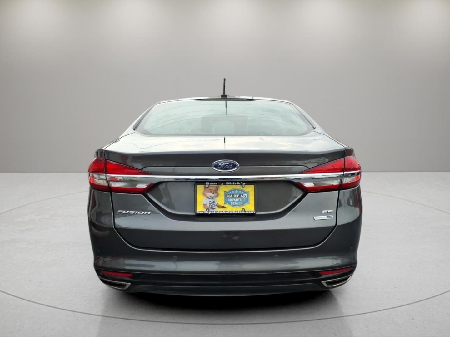 2018 Magnetic J7 Ford Fusion SE (3FA6P0T91JR) with an 2.0L EcoBoost 2.0L Turbo I4 245hp 275ft. lbs. Direct Injection engine, 6-Speed Shiftable Automatic transmission, located at 5505 N. Summit St., Toledo, OH, 43611, (419) 729-2688, 41.654953, -83.530014- Photo#23